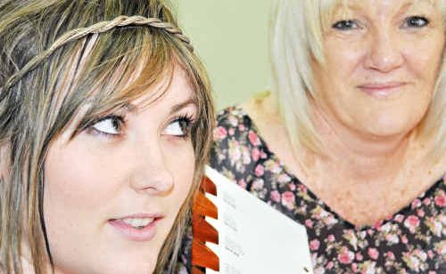 Bec Wiggan ponders the red revolt with Hair Kreations artistic director Tina King. Bec Wiggan ponders the red revolt with Hair Kreations artistic director Tina King.